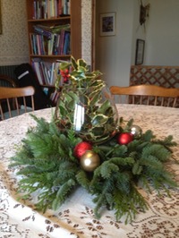 Four B’s Farm evergreen centerpiece with holly