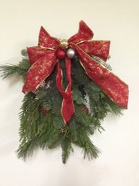 Evergreen door charm with holly berries
